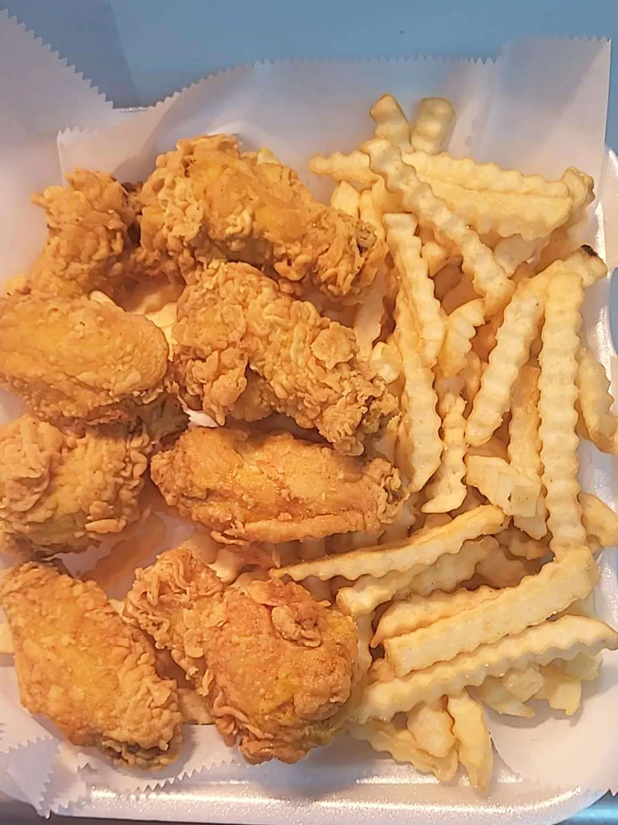 Chicken wings with fries at Seagull Seafood，a Seafood Restaurant in Mobile